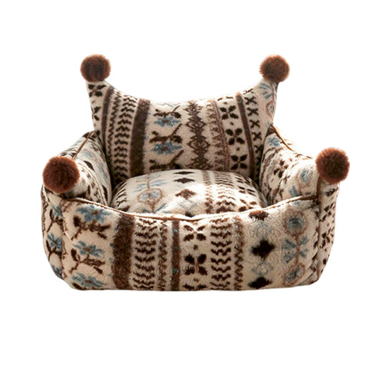 Patterned bolster pet bed with pom-pom corners