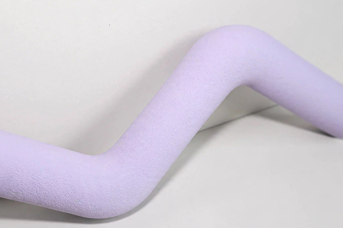 Close-up of purple lightning Z-shaped rubber dog toy texture