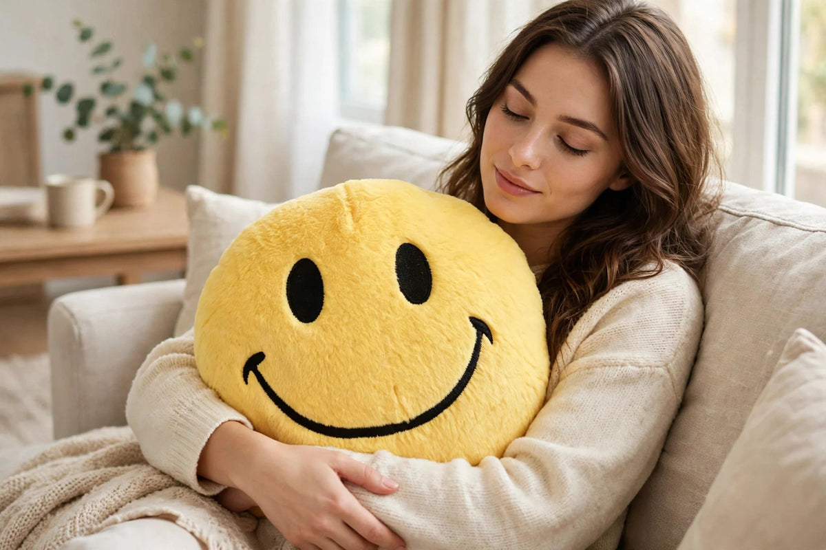 Owner relaxing on sofa hugging yellow smiley face plush pillow