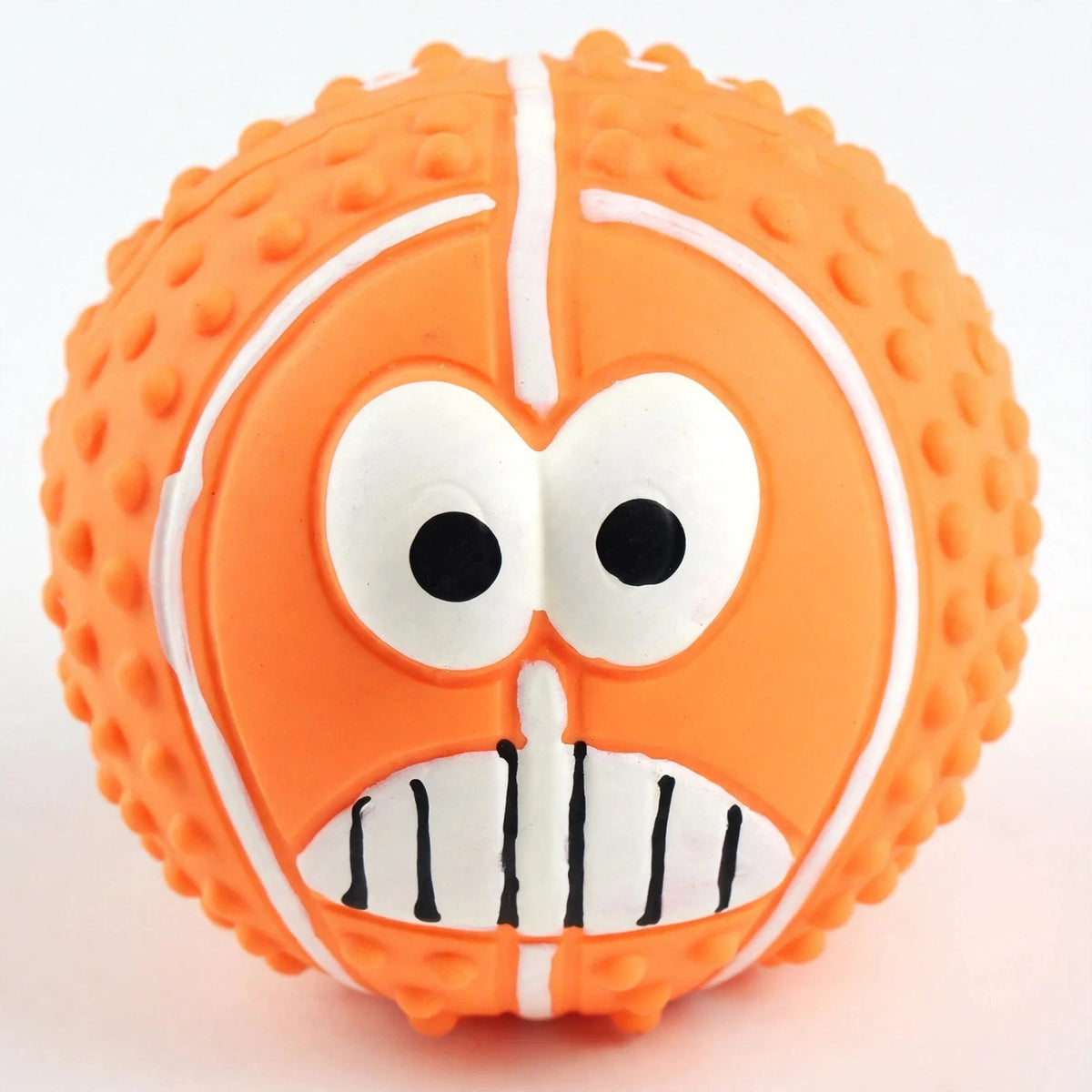 Close-up of orange latex smiley ball face and bumpy texture