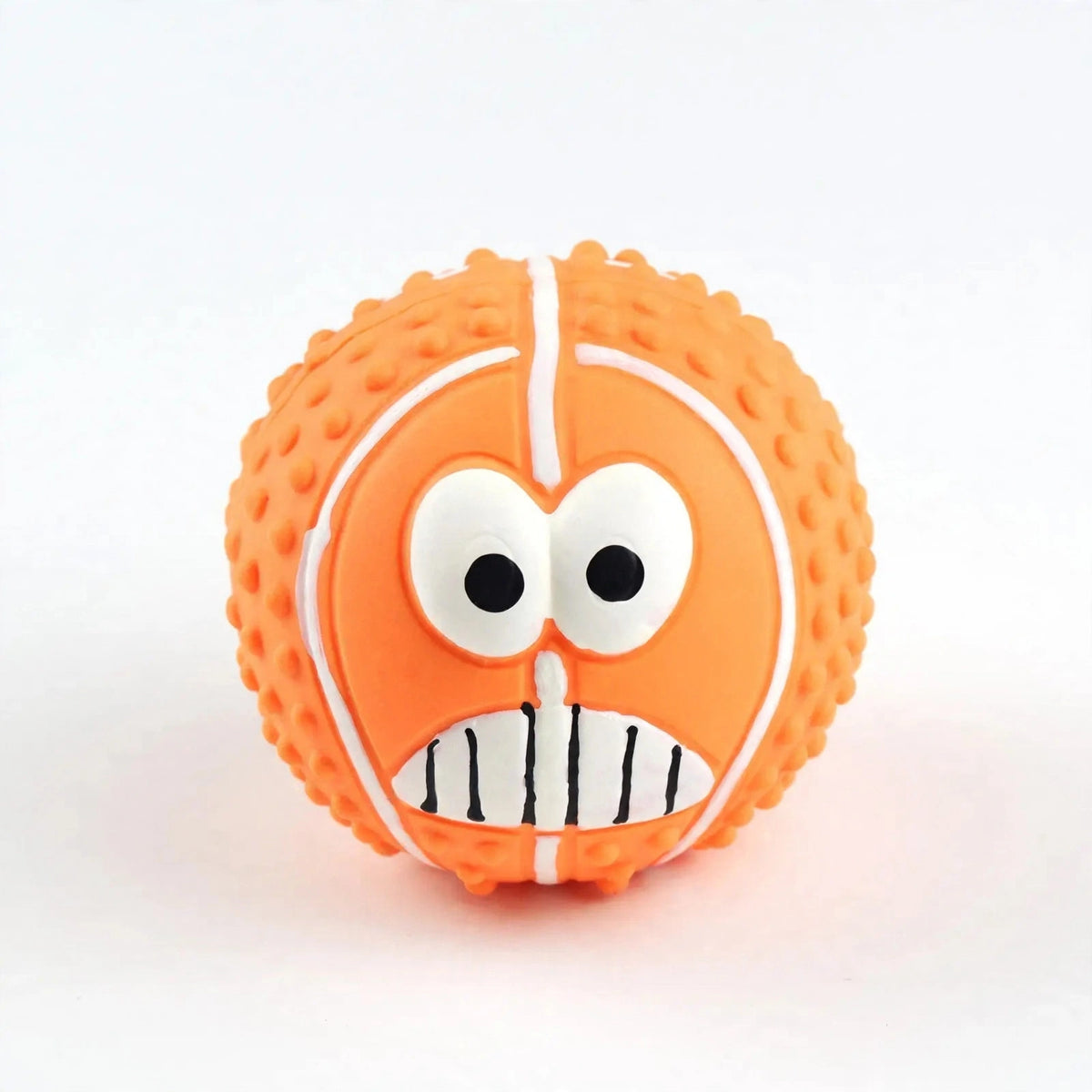 Orange latex smiley ball on white background, front view